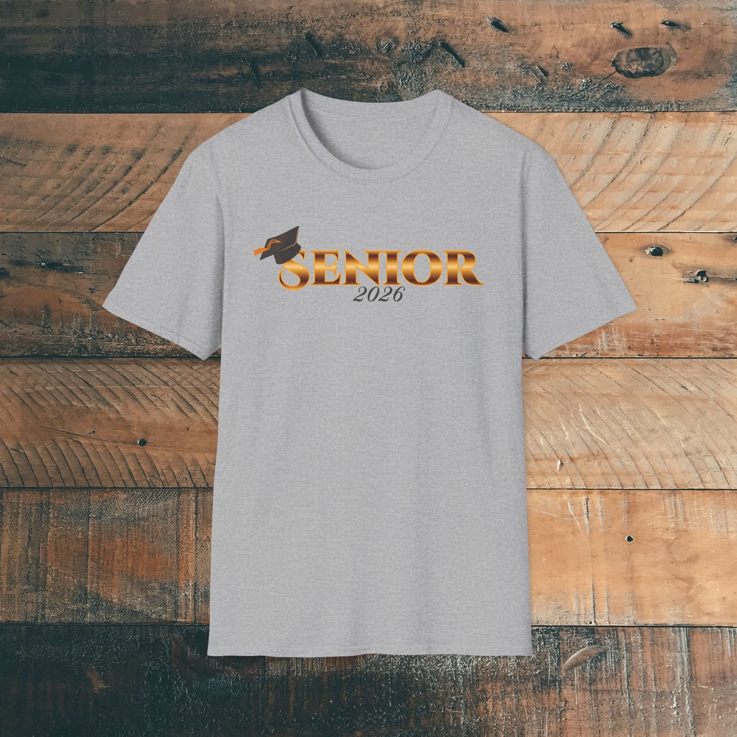 Gray t-shirt with 'Senior 2026' gold text design on a wooden background.
Brilliantmischief.shop
