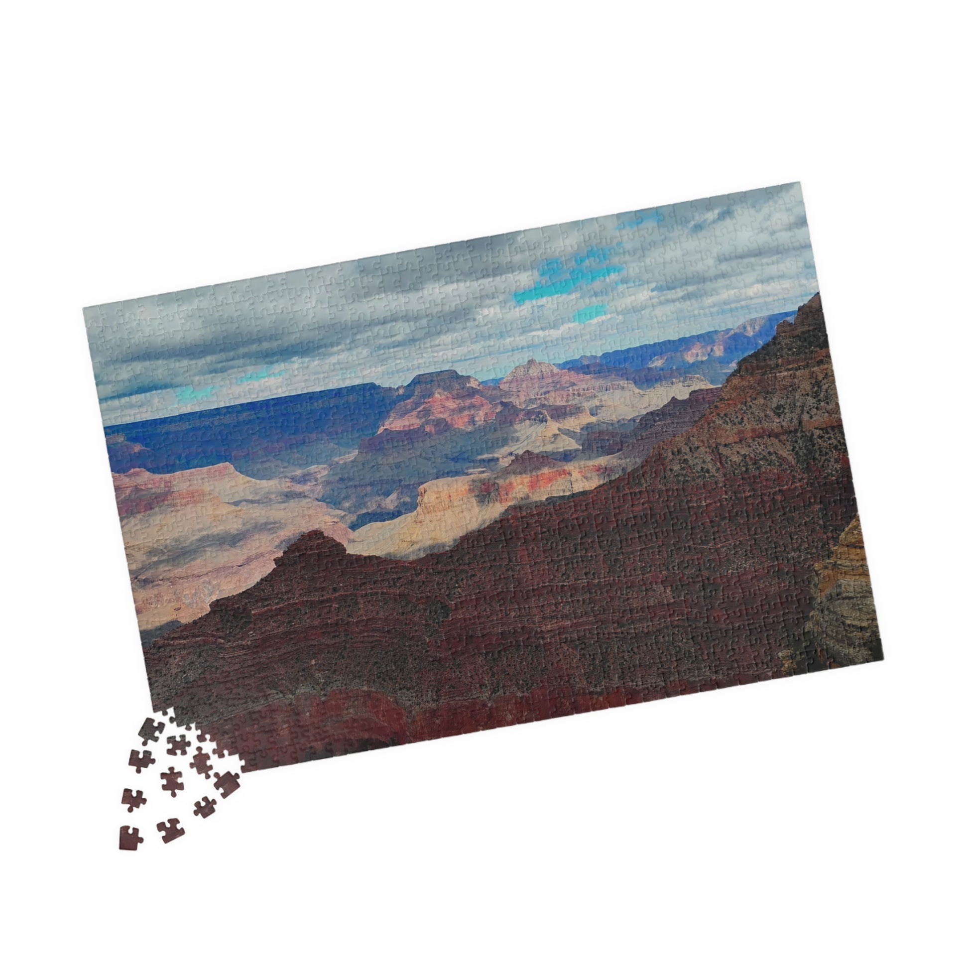 Jigsaw puzzle with a Grand Canyon landscape design on a white background