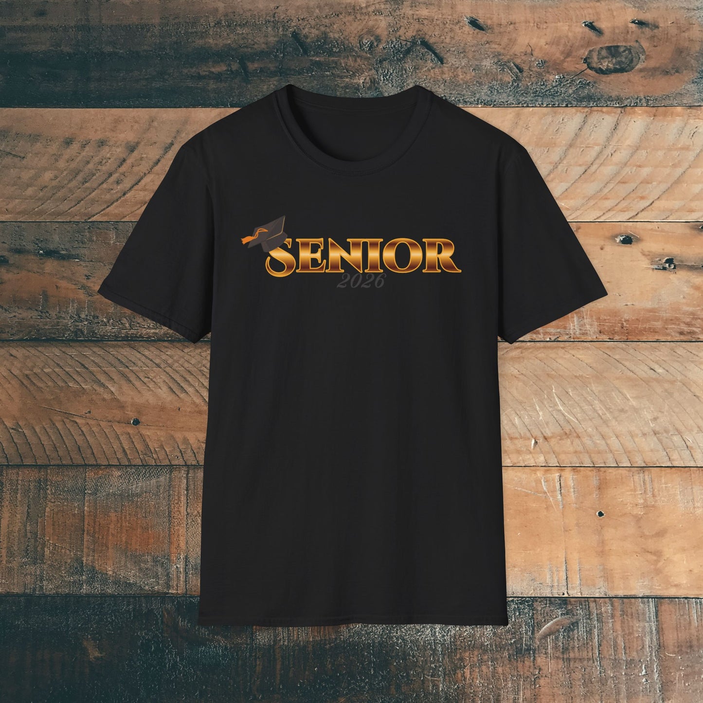 Black t-shirt with 'Senior 2026' gold text design on a wooden background.
Brilliantmischief.shop