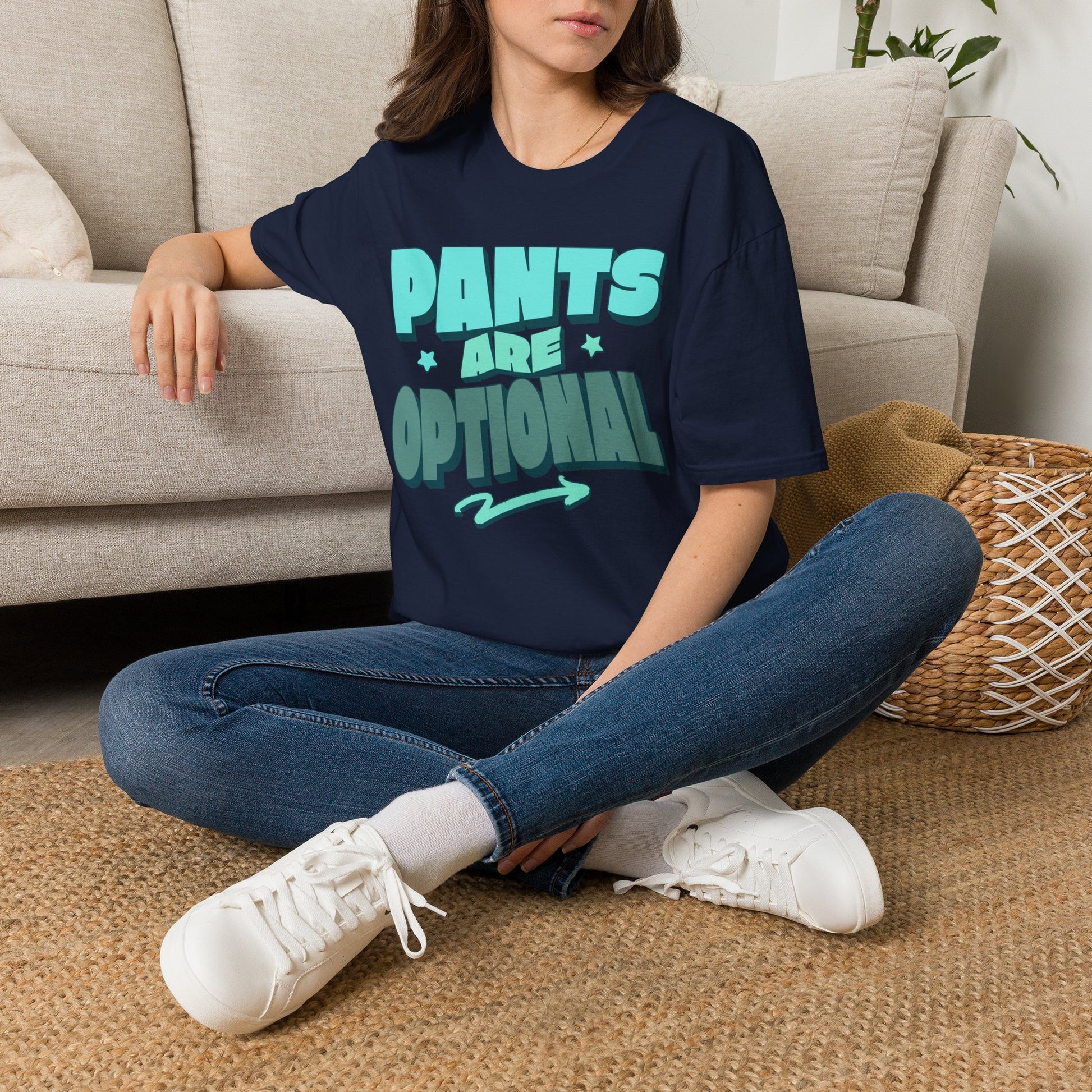 Person wearing a navy blue t-shirt with 'Pants are Optional' text, sitting on the floor. Brilliantmischief.shop