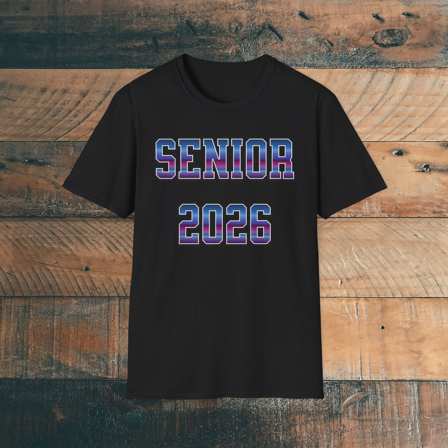 Black t-shirt with 'SENIOR 2026' in purple and blue bold text on a wooden background. Brilliantmischief.shop